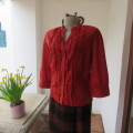 Fire up in a bright burnt orange 100% cotton button down top size 38/14. Frilled front.New condition