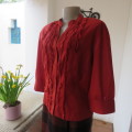 Fire up in a bright burnt orange 100% cotton button down top size 38/14. Frilled front.New condition