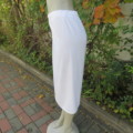 Comfy smart white straight cut skirt in textured polyester. Pleat at back.Elasticated waist. Size 38