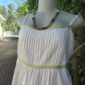 Perfect for the summer pregnancy!. Adjustable shoulder straps. Cream with gold embroidery.Size 42/44