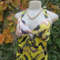 Cool sexy top in yellow,navy,beige. 3 thin shoulder straps. Build in bra. Size 36. By RT. Stretch.