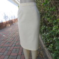 Rich cream textured polyester 80`s pencil skirt with concertina pleat at back.Size 34. As new