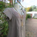 Chic loose ecru colour knee length dress. Capped sleeves.Front lace decoration.Size 36/12. As new.