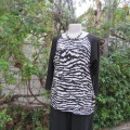 Black slip over top with long raglan sleeves. Front B/W animal print.100% polyester. Amara size 40.