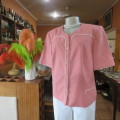 Smart hip length apricot colour short sleeve lined jacket with cream cord edging.Size 42 by MATSON