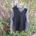 Men`s black acrylic knit pullover. Diamond pattern.White edging.Striped attached sleeved/collar.Med