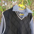 Men`s black acrylic knit pullover. Diamond pattern.White edging.Striped attached sleeved/collar.Med