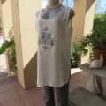 High quality long textured cream polyester top. Sleeveless. Exotic silver front embroidery. Size 36