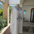 High quality long textured cream polyester top. Sleeveless. Exotic silver front embroidery. Size 36