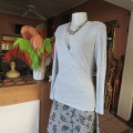Silver grey long sleeve size 36/12 empire waist top with fold over bust. By JFK. Stretch viscose.