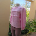 Romantic rose pink top. Long puffed sleeves and button down back.Decorative front tucking.Size 35/11