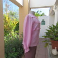 Romantic rose pink top. Long puffed sleeves and button down back.Decorative front tucking.Size 35/11