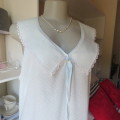 Cool summer dacron nighty in baby blue/white dots size 44/20. Pretty striped collar. Front opening.