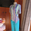 Beautiful fold over 80`s top in 100% viscose. Blue/green/yellow pattern stripes. Ties at side. 36
