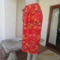 Vibrant calf length textured polyester skirt in shades of crimson. Orange/yellow flowers. Size 44