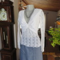 Attractive acrylic stretch lace pull over long sleeve cream top.Knot in center of lined bust.Size 37