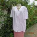 White polynylon, light as a feather short sleeve top with tiny pink flowers. Size 44.V neck.New cond