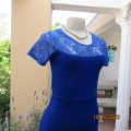Pretty royal blue knee length bodycon dress in textured stretch polyester.Size 32/8. Doll 34. As new