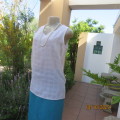 Lovely sleeveless slip over white top in creased polyester with embossed check pattern. Size 34/10.
