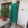 Irresistible emerald green knife pleated calf length skirt size 36/12. Label cut. Sheer poly. As new