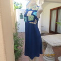 Ultra chic navy empire style polyester dress. Top with pattern blocks. Stunning low back. Size 38/14