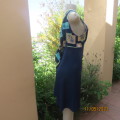 Ultra chic navy empire style polyester dress. Top with pattern blocks. Stunning low back. Size 38/14