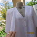 Ultra chic and versatile white V neck button down top with 2 extra loose fronts. Size 42 by DONNA C.