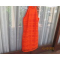 Outrageous orange sexy dress in heavy polyester lace/stretch poly lining. Size 30 by WOOLWORTHS.New