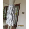 Luxurious silver grey stretch crushed velvet skirt. With 3 flare frills.Size zip.Size 36. Never used