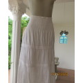 Beautiful snow white ankle length tiered skirt.Elasticated yoke. Embroidered/lace seams.38 by NEWS.