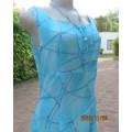 Turquoise maxi a-line dress with empire waist.Size 34/10..In textured polyester.Made by owner.As new