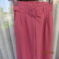 Stunning rouge pink wide legged pants with pleated front/elastic back. Front belt. Size 30/6.As new