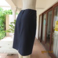 The handy navy pencil fully lined skirt for work. Poly/rayon blend. Size 36/12 by DAYTIMERS.New cond