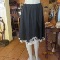 Fabulous black 100% cotton skirt/white embroidered hem elasticated waist size 38 `ATMOSPHERE`.