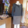 Elegant black jersey shift dress with black/brown striped bottom. Long sleeves. Size 34 from Korea.