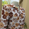 Vintage tailored long cuffed sleeve cream/brown floral top by DELSWA size 37/13. As new. Heavy poly.