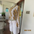 Pretty creased polyester cropped long sleeve pattern striped top.Bell sleeve cuffs.Size 34.