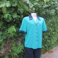 Beautiful jade silky polyester short sleeve top with navy open collar. By WOOLWORTHS size 38. As new