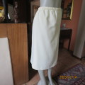 Easy to wear cream fully lined pencil skirt in textured polyester. Boutique made size 40. New cond.