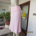 Stunning pale pink stretch poly/viscose skirt by OASIS size 34/10. Unique side panels, Brand new con