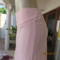 Stunning pale pink stretch poly/viscose skirt by OASIS size 34/10. Unique side panels, Brand new con