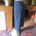Elegant ankle length navy no stretch polyester pencil skirt size 36/12. Zip/slit at back. New cond.