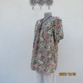 Must have floral printed loose slip over 100% viscose short sleeve top.Size 38. Pleats on front.