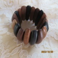 Stunning wooden stretch bracelet made up of different woods. Width 5cm. New condition.