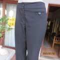 Very black bootlegged smart WOOLWORTHS polyester pants size 36/12. Inner leg 73cm. As new.