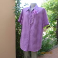 Striking vertical striped short sleeve polyester/rayon top in 3 shades of lilac.By DONNA CLAIRE 44.