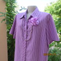 Striking vertical striped short sleeve polyester/rayon top in 3 shades of lilac.By DONNA CLAIRE 44.
