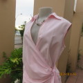 As new coral peach sleeveless cross over top with ties at side. Collar. Stretch polycotton.Size 42