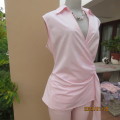 As new coral peach sleeveless cross over top with ties at side. Collar. Stretch polycotton.Size 42