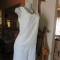 Chic light cream scooped neckline sleeveless top in stretch polyester. Lace hemline. By TRUWORTHS 34